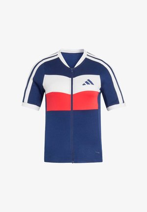 Laivastonsininen urheilupaita lyhyillä hihoilla, jossa edessä vetoketju, valkoiset ja punaiset vaakaraidat, valkoinen kaulus, olkapääraidat ja Adidas-logo rinnassa.