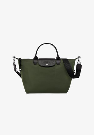 Olive green handbag made of durable fabric, features black leather accents, a front pocket, and dual handles with an adjustable strap.