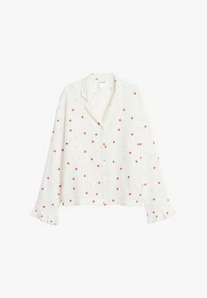 Hvid langærmet skjorte med knapper, pyntet med små røde og lyserøde hjerteprint og flæsekant ved ærmerne.