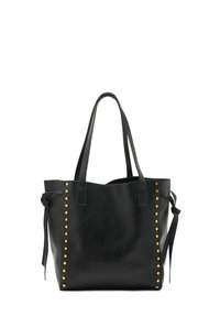 Black leather tote bag with two shoulder straps, features yellow studs along the side, and a smooth textured finish.