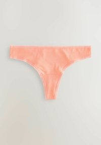Thong color pesca in cotone con una texture liscia, vita elasticizzata e dettagli minimi lungo i bordi.