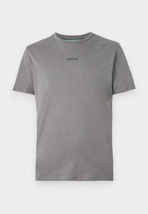 Lichtgrijze T-shirt gemaakt van katoen, met korte mouwen en een ronde hals. "REPLAY" is in zwart geborduurd op de borst.