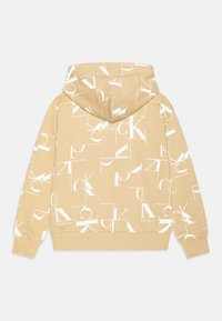 Felpa con cappuccio beige con un motivo grafico di lettere bianche. Presenta polsini e orlo a coste, e una tasca a marsupio. Materiale in morbido cotone misto.