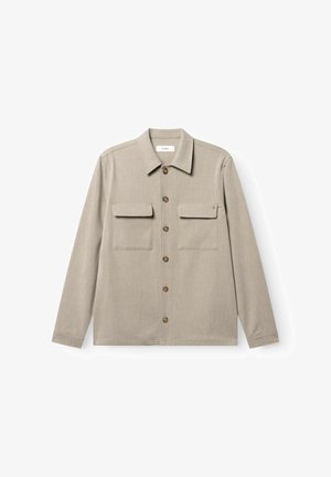 Beige long-sleeve button-up shirt with two chest flap pockets and a pointed collar on a white background.