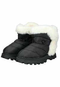 Bottes de cheville noires rembourrées avec un revers en fausse fourrure blanche, dotées d'une semelle en caoutchouc texturé et de détails cousus sur la tige.