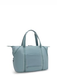 Light blue duffel bag made of durable material, featuring white accent stripes, dual handles, a zip closure, and a front pocket.