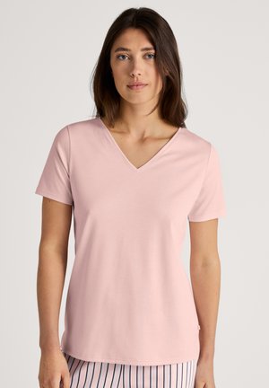 Pink v-neck t-shirt made of soft cotton fabric. Short sleeves and relaxed fit, featuring a smooth texture and minimal design.