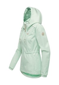 Veste de pluie à capuche pour femme de couleur vert clair avec fermeture éclair à l'avant, cordons de serrage réglables, poignets élastiques et doublure intérieure à motif floral dans la capuche.
