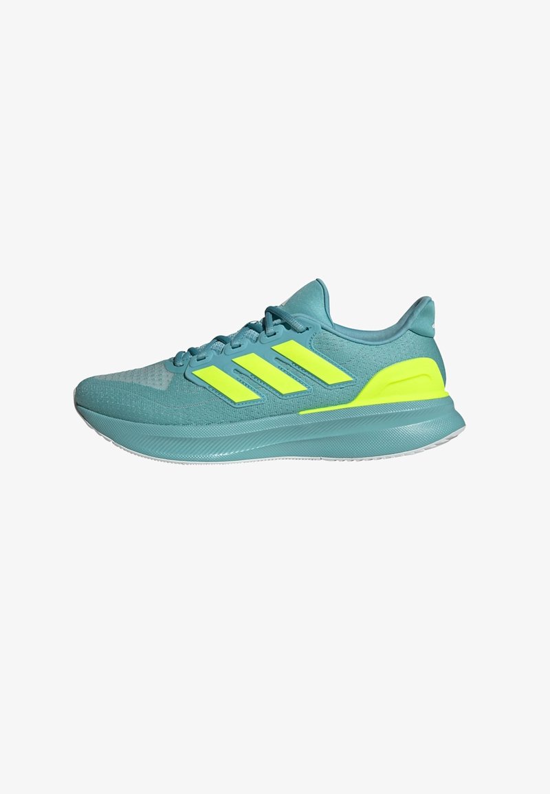 Zapatos deportivos de color azul claro con parte superior de malla, tres franjas amarillas, suela texturizada y collar acolchado para mayor comodidad.