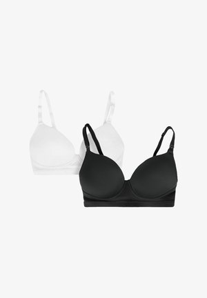 Kaksi rintaliiviä: yksi valkoinen ja yksi musta. Molemmissa on sileä, muotoiltu muotoilu, säädettävät olkaimet ja saumaton reuna.