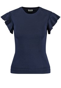 Námořnická modrá hladká top s krátkým rukávem, ozdobený volánky a kulatým výstřihem. Tkanina má hladkou strukturu, přiléhavý střih a jemné švy.