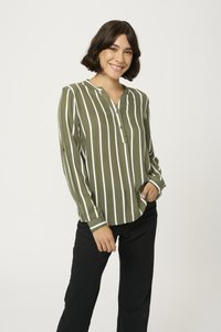 Olive green long-sleeve button-up shirt with white vertical stripes and a V-neckline. Soft fabric with a relaxed fit, paired with black pants.