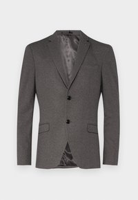 Grå blazer med två svarta knappar, notch lapels och två framfickor. Texturerad tyg med en släta innerfoder och ett enda bakventil.