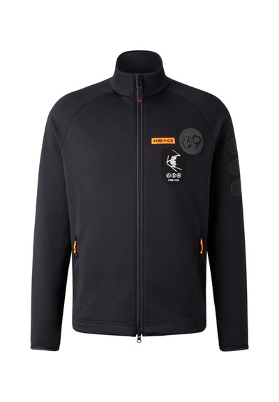 Black zip-up jacket with stand collar, featuring orange accents, logos, and patches, and textured shoulder details. Front zip pockets included.