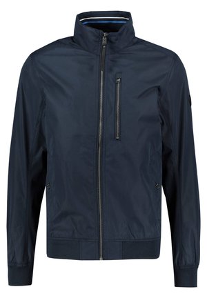Veste légère pour homme bleu marine avec col montant, fermeture éclair intégrale à l’avant, poche poitrine verticale et poches latérales à boutons.