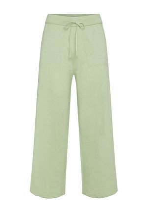 Pantalones de pierna ancha color verde claro, hechos de una tela suave. Cuentan con una cintura elástica con un cordón y un bolsillo en la parte delantera.