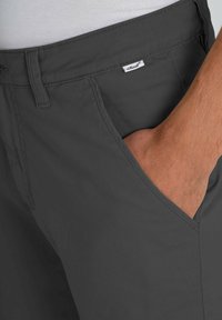 Gray cotton-blend trousers with a smooth texture. Features a front pocket and a small brand label stitched on the waistband.