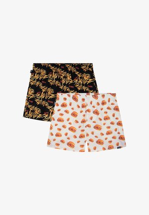 Deux paires de shorts à taille élastique, une noire avec un motif de frites jaunes, une blanche avec diverses illustrations de cheeseburgers.