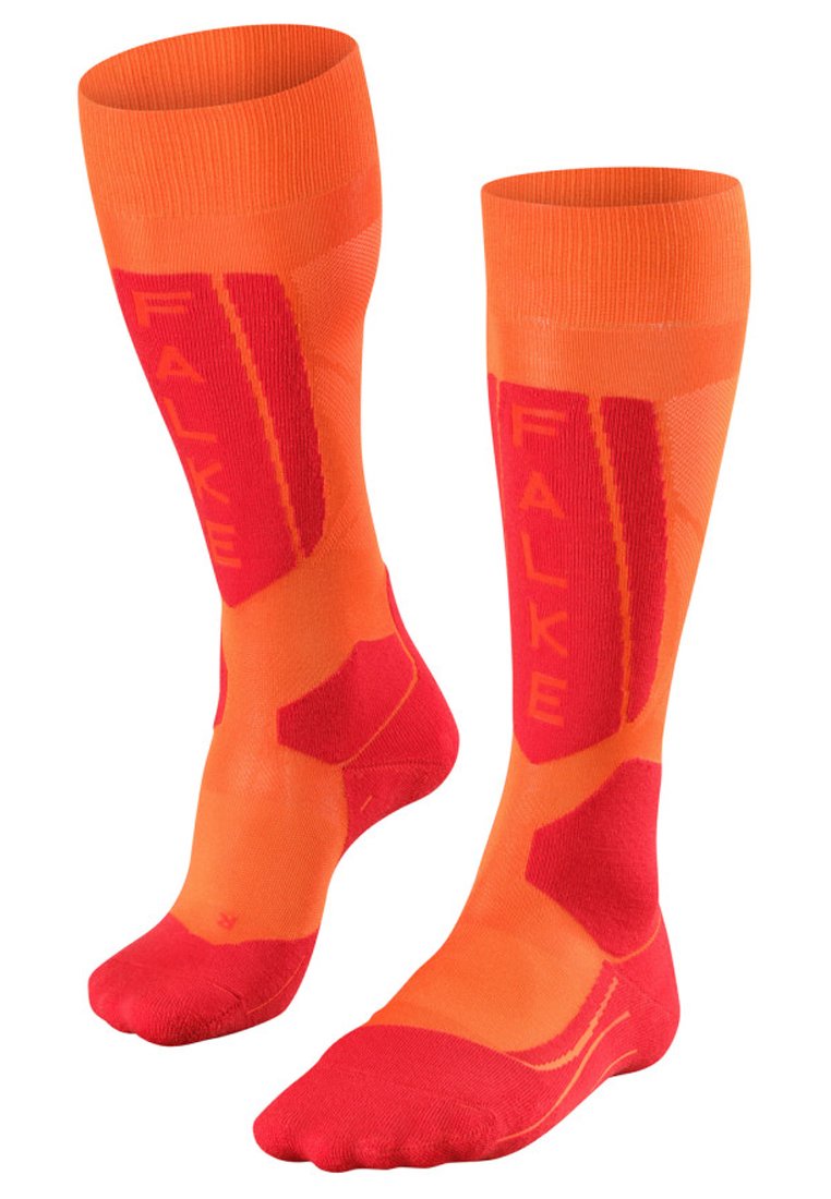 Helle orange Kniestrümpfe in knielanger Ausführung mit roten Akzenten. Enthält das FALKE-Logo und strukturierte Bereiche für eine verbesserte Passform und Komfort.