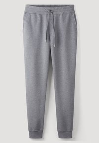 Grå bomullsbyxor med dragsko i midjan, avslutade anklar och sidofickor med en mjuk, slät textur.