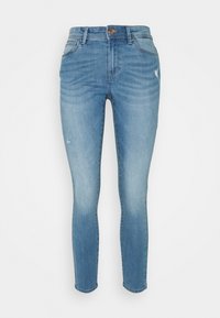 Jeans justos feitos de denim azul claro, apresentando um efeito desbotado, ligeiras desgastes na parte da frente e um design clássico de 5 bolsos.