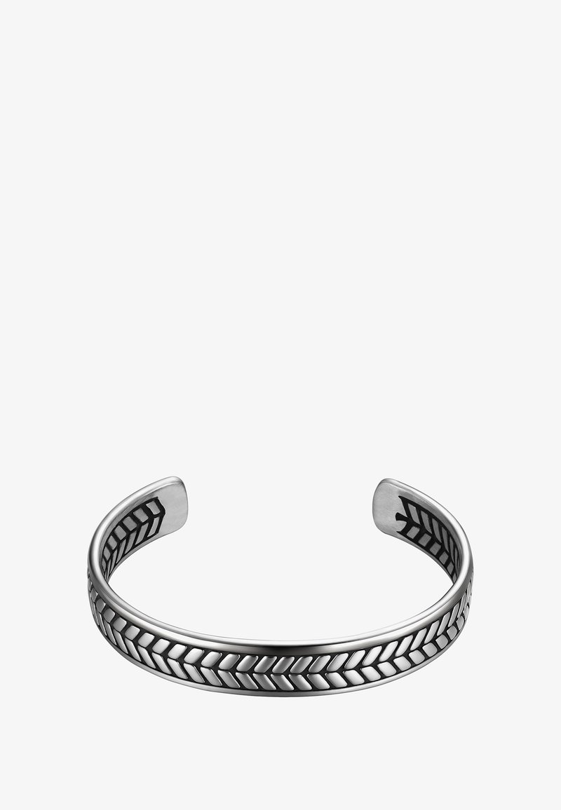 Náhradný náramok z striebra s lesklým povrchom, s vyvýšeným vzorom chevronu pozdĺž stredu a hladkými zaoblenými okrajmi.