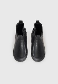 Black leather ankle boots with a smooth finish, side zippers, and a rounded toe. Features textured accents and cushioned inner lining.