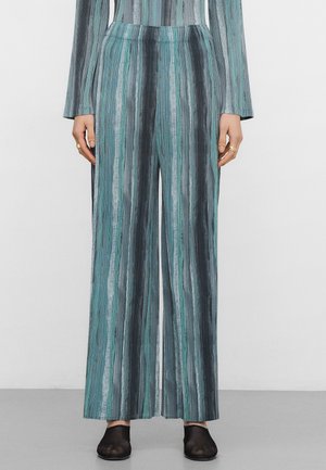 - Spodnie materiałowe