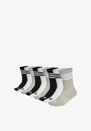Negen paar enkellange sokken in zwart, wit en grijs, elk met twee horizontale strepen bij de boord en een logo op de voet.