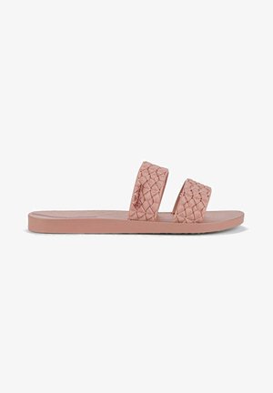 Sandalini rosa con due cinturini intrecciati, suola texturizzata e design piatto. Realizzati in un materiale flessibile per comfort e durata.
