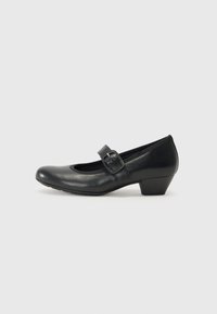 Black leather Mary Jane shoe with a rounded toe, a small block heel, and an adjustable buckle strap across the instep. Smooth texture.
