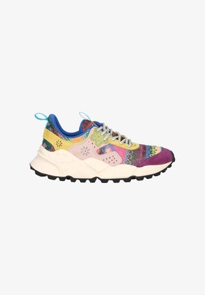 Multicolored sneaker with a textured upper combining fabric and suede in shades of pink, yellow, purple, and blue. Chunky black sole.