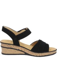 Sandalias de cuña negras con una suela de corcho texturizada, correas anchas y una parte superior de tela suave. Estilo fácil de poner con un diseño de punta abierta.