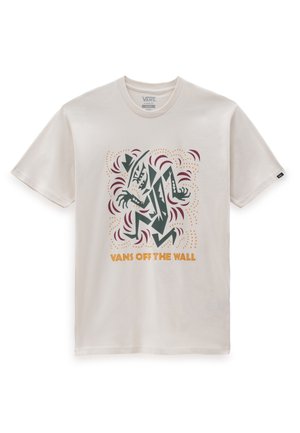T-shirt blanc Vans avec un graphisme abstrait vert, marron et jaune d’une figure stylisée au-dessus du texte "VANS OFF THE WALL".