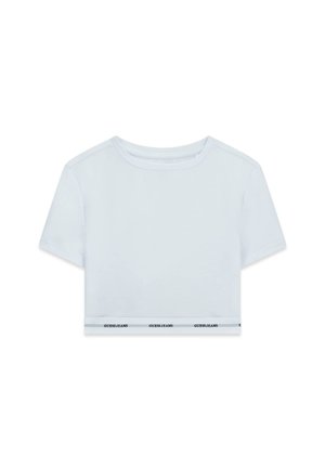 Witte cropped t-shirt met korte mouwen, voorzien van een ronde halslijn en een contrasterende band aan de zoom met "GUESS JEANS" in zwarte tekst.