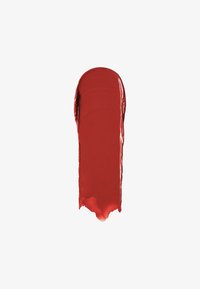 Vivid red paint swatch with a glossy texture. The swatch has a smooth surface and tapered edges, showcasing a fluid consistency.