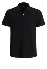 Polo noir en coton, avec des manches courtes, une patte de boutonnage à deux boutons et un col. L'étiquette affiche "GAP" à l'intérieur.