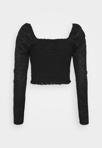 Svart kort topp med långa ärmar, tillverkad av texturerad tyg med blommönster. Fyrkantig halsringning och rynkade ärmdetaljer.