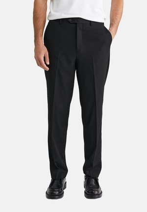 Melnas bikses ar taisnu kāju dizainu, plakanu priekšpusi, divām iegriezumu kabatām un pogas aizdari. Izgatavotas no gludas auduma.