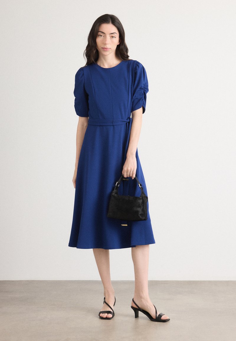 blue dkny dress Womens Zippered Lined Twist-side Hi-lo Hem Balloon Sleeve Su – Bobbi + Bricka allowing you to wear it cinched or relaxed for easy day NEW DKNY Royal Blue Dress