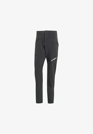 Black outdoor pants made from a flexible material. Features multiple zippered pockets and a logo on the lower leg. Tailored fit design.