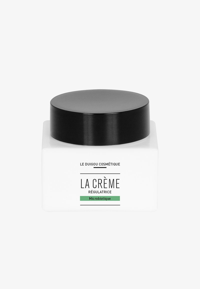 Bocal square blanc avec un couvercle noir lisse, présentant des étiquettes en noir et vert, indiquant le nom du produit et le type.