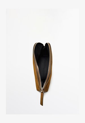 Brown suede pouch with a black interior, featuring a double zipper closure, elongated shape, and leather pull tab.