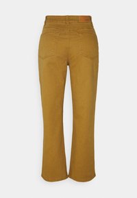 Braune weit geschnittene Jeans aus einem Baumwollmischgewebe. Mit einer mittelhohen Taille und zwei Gesäßtaschen. Glatte Textur in unifarbener Ausführung.