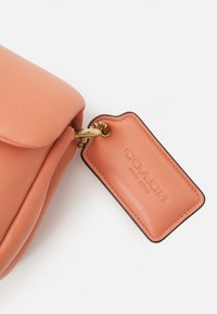 COACH COVERED CLOSURE PILLOW TABBY SHOULDER - Handbag - light coral