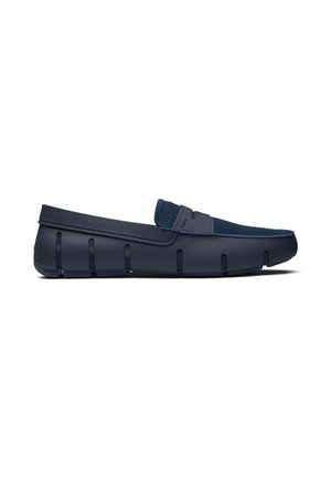 Navy blue slip-on loafer with mesh upper, rubber sole featuring cut-out vents, and a branded strap across the top.