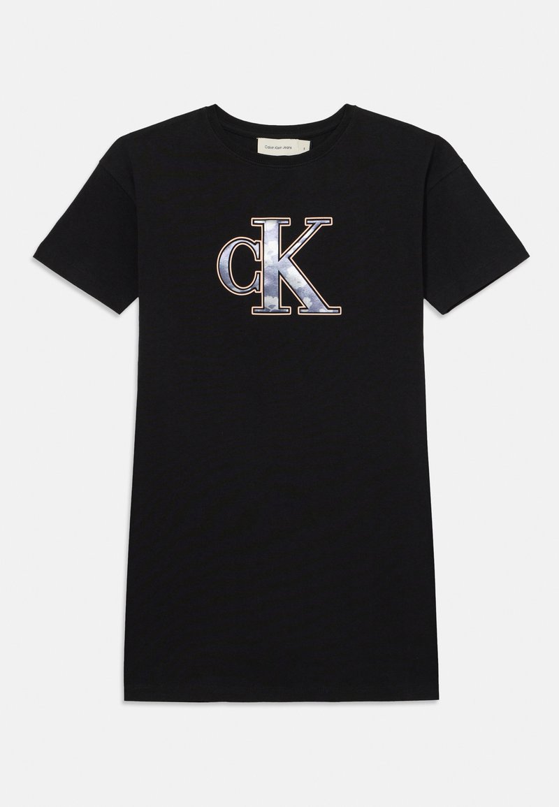 Black cotton t-shirt featuring a large, metallic silver and blue "CK" logo on the front. Short sleeves, crew neck design.
