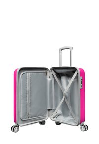 Hard-shell suitcase with a bright pink exterior, silver interior lining, retractable handle, and four spinner wheels. Compartments for organization.