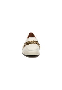 White leather loafers featuring a gold chain accent across the front. Rounded toe and smooth texture, with a contrasting brown interior.