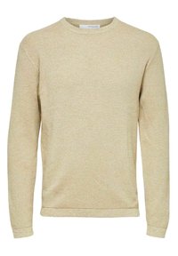 Maglione lavorato a maglia in beige chiaro con un motivo testurizzato. Presenta maniche lunghe, scollatura rotonda e polsini e orlo a coste.